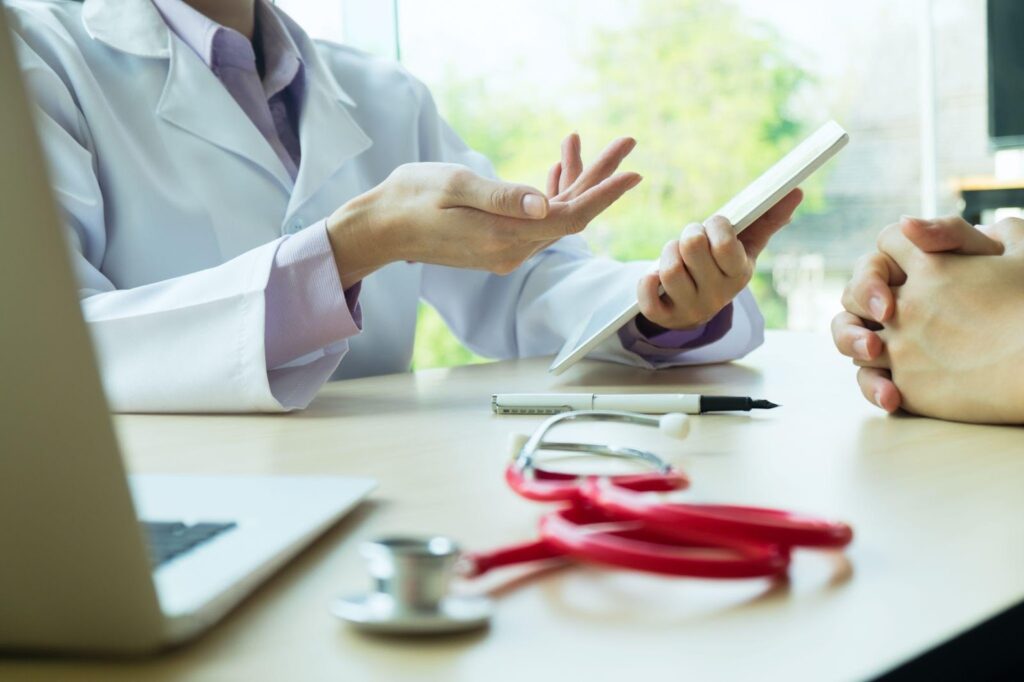 Doctor and patient engaged in conversation, illustrating informed consent discussion.