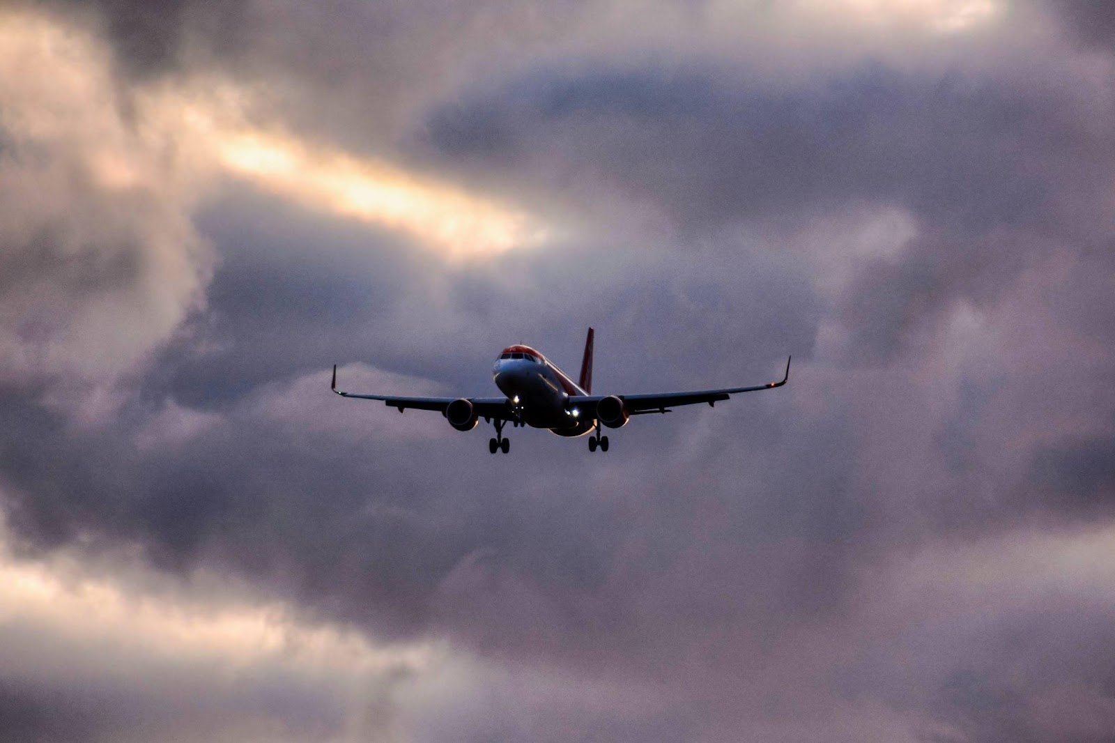 An airplane flying high in the sky, symbolizing airline and aviation travel, with a focus on the risks associated with airline and aviation accidents.