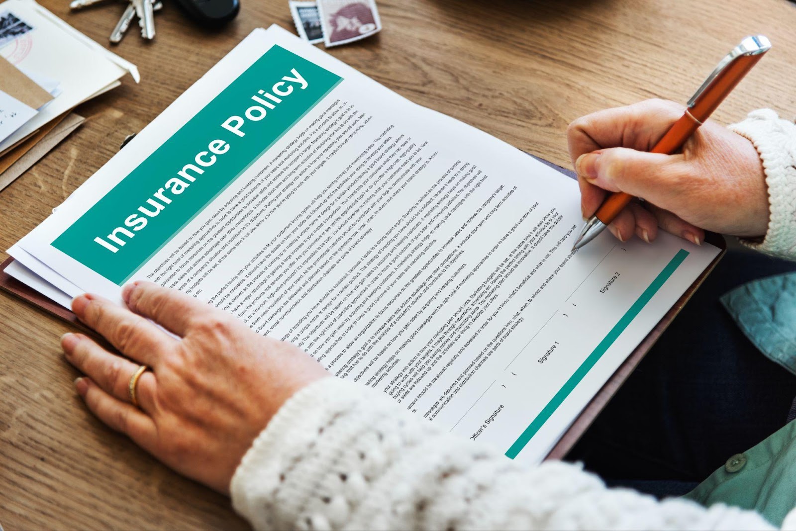 A person carefully reading an insurance policy document, highlighting attention to detail. This image relates to insurance coverage, emphasizing the importance of understanding policy limits and the different types of coverage available.