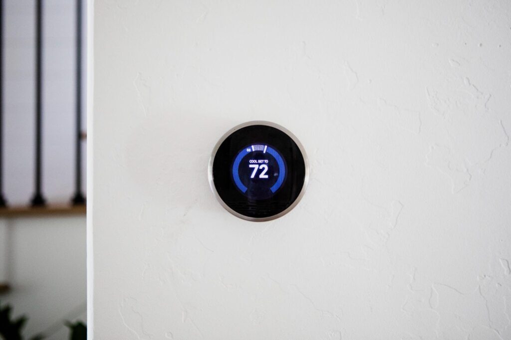 A close-up of a home thermostat, symbolizing household appliances that could potentially emit carbon monoxide. This image relates to carbon monoxide poisoning, emphasizing its sources, symptoms, and the legal claims that may result from exposure.